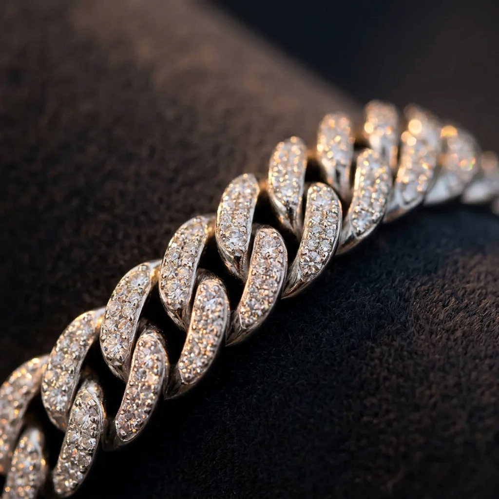 Macro detail of 6mm VVS1 moissanite Cuban link bracelet geometric S-design links in 925 sterling silver catching warm light
