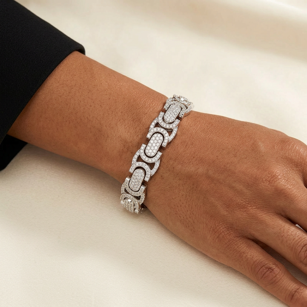 AI-generated styling image of a silver-tone Moissanite bracelet worn on a model’s wrist beside a black tailored sleeve.